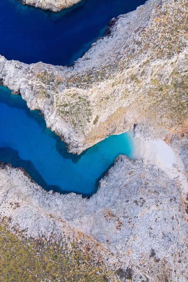 Turquoise bay and secluded beach at Seitan Limania, offering a perfect stop for boat tourists in Crete.